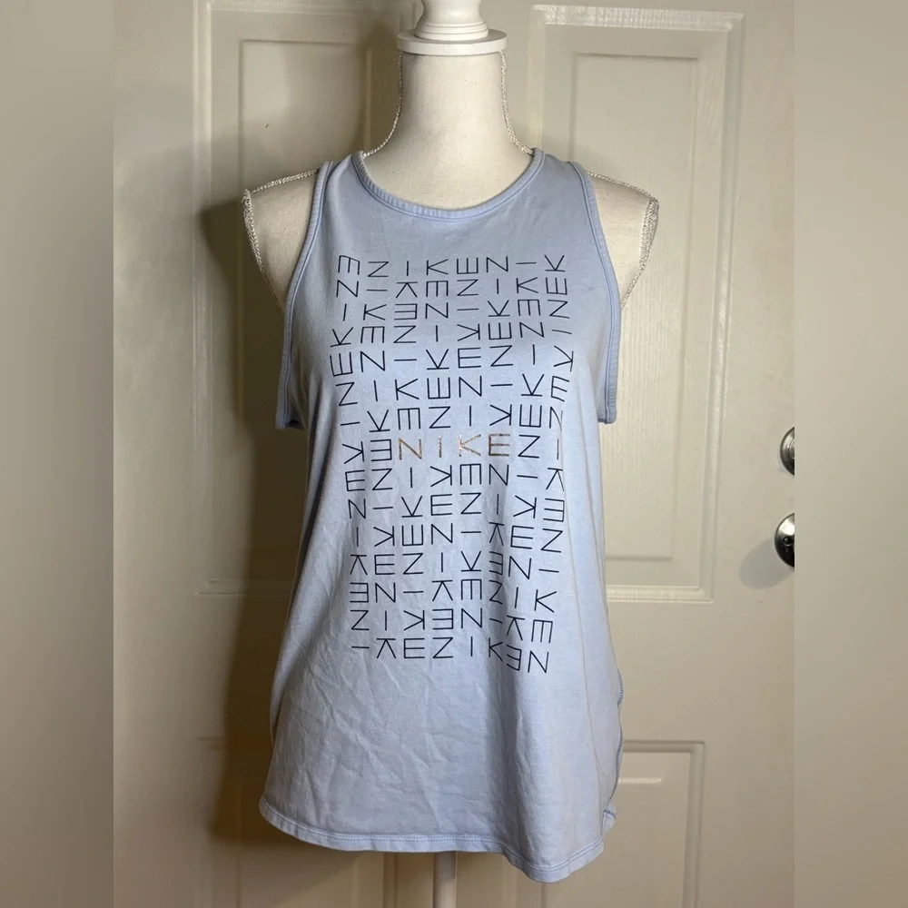 Nike light blue tank top with logo pattern. Size Medium.